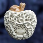 Apple-Shaped Candle Holder - White color with a golden leaf and a stalk